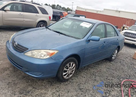 2003 Toyota Camry Le z USA, uszkodzony, nr VIN JTDBE32K030236131